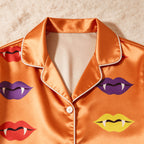 Orange Vampire Lips & Fangs Print Satin Button-Up Family Halloween Pajamas Set