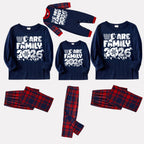 We Are Family 2026 Christmas Pajamas Set - Navy Top Red and Navy Plaid Pants White Text Graphic